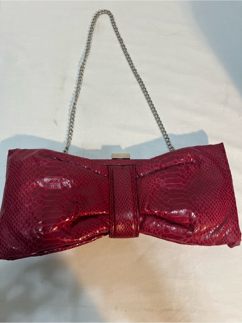 Aldo Fuchsia Snake-Embossed Bow Chain Crossbody